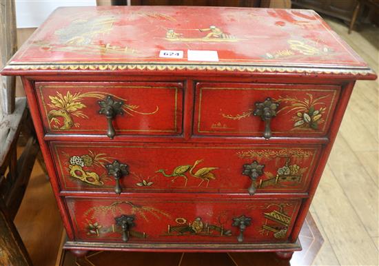 A miniature Chinese red lacquer cabinet, W.51cm